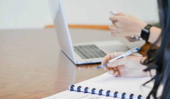 woman accounting talking to colleague