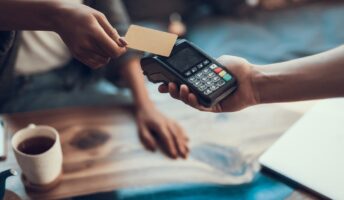 Customer paying server with card