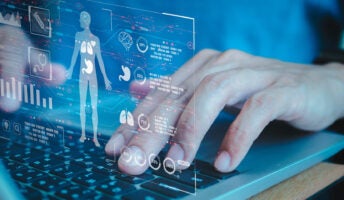 Image of hands typing on a computer depicting concept of technology like AI chatbots knowing personal data