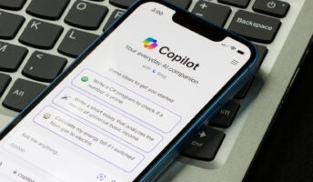 Copilot creation screen open on mobile resting on laptop
