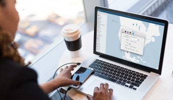 woman accessing vpn on a laptop in an office