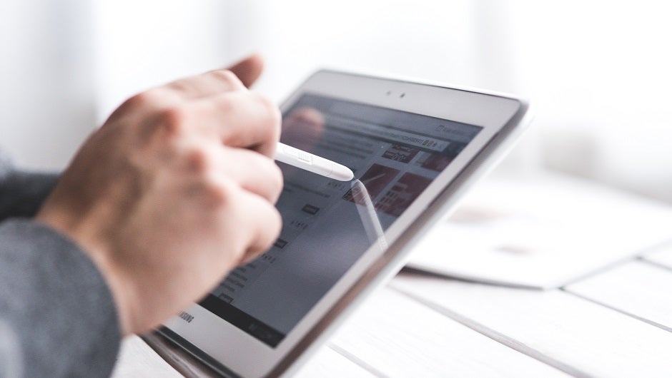 technology changed work life - person drawing on tablet device