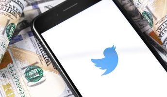 Twitter logo on U.S. dollars